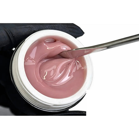 Gel de construction Camouflage Browny Nude Beauty Distribution, builder gel nude brun rosé en pot, texture épaisse et brillante sur spatule, idéal gainage, extension d’ongles, rallongement et manucure professionnelle.