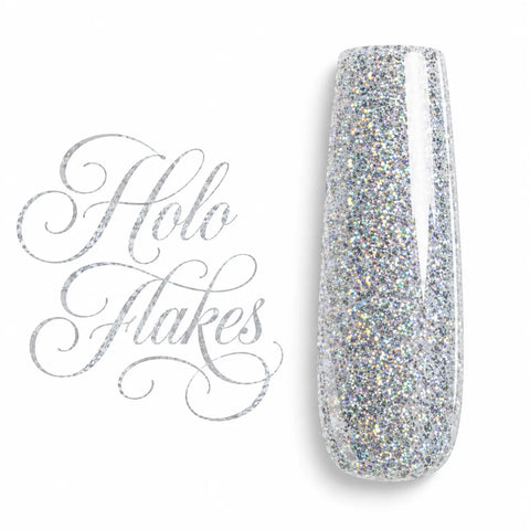 Capsule d’ongle ballerine Holo Flakes, gel UV LED argenté holographique aux éclats multicolores, finition ultra brillante sur fond blanc.
