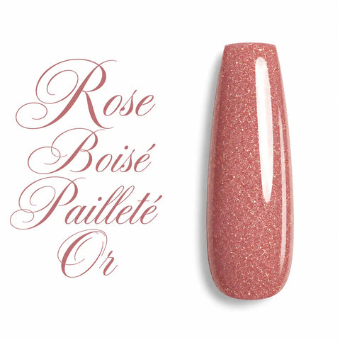 Gel UV couleur Rose Boisé Pailleté Or sur capsule ballerine brillante – vernis semi-permanent rose boisé nude aux fines paillettes dorées, finition ultra glossy, nuancier professionnel pour manucure, nail art, gainage, construction en gel et pose américaine.