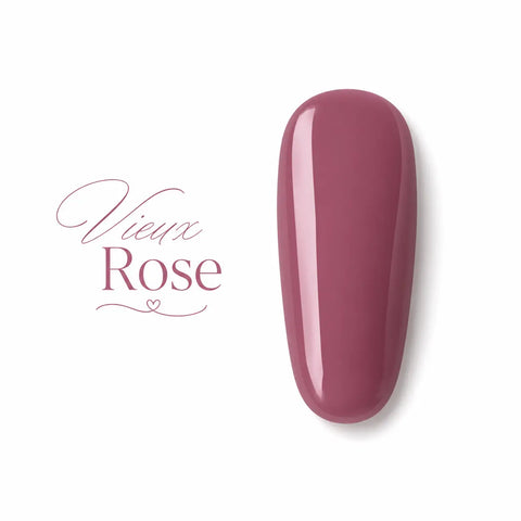 Vernis gel Beauty Distribution couleur vieux rose, flacon 10 ml sur fond blanc avec pastille de couleur rose poudré brillante, packshot luxe pour manucure et prothésie ongulaire.
