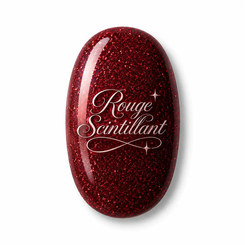 Vernis gel Rouge Scintillant Beauty Distribution, teinte rouge profond pailleté sur capsule glossy, finition brillante effet gel professionnel avec reflets lumineux pour manucure glamour, festive et élégante.